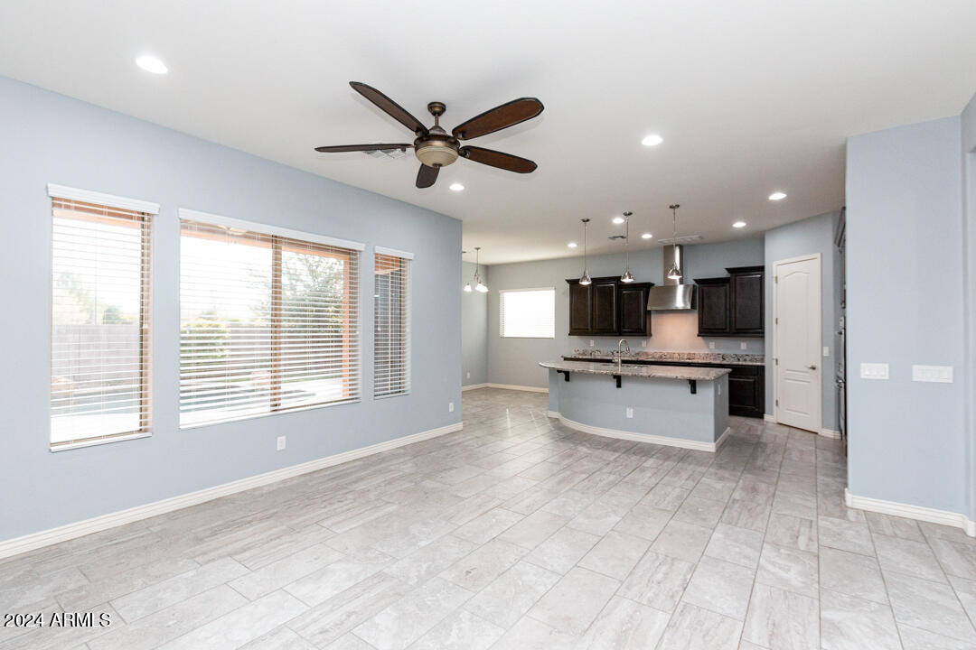 Undisclosed Address Gilbert, AZ 85298 - Photo 20 of 36 a view of a living room kitchen and windows