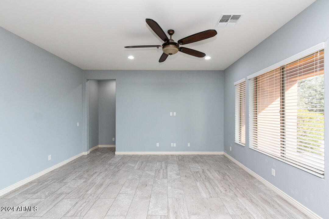 Undisclosed Address Gilbert, AZ 85298 - Photo 21 of 36 a view of a livingroom with a ceiling fan and window