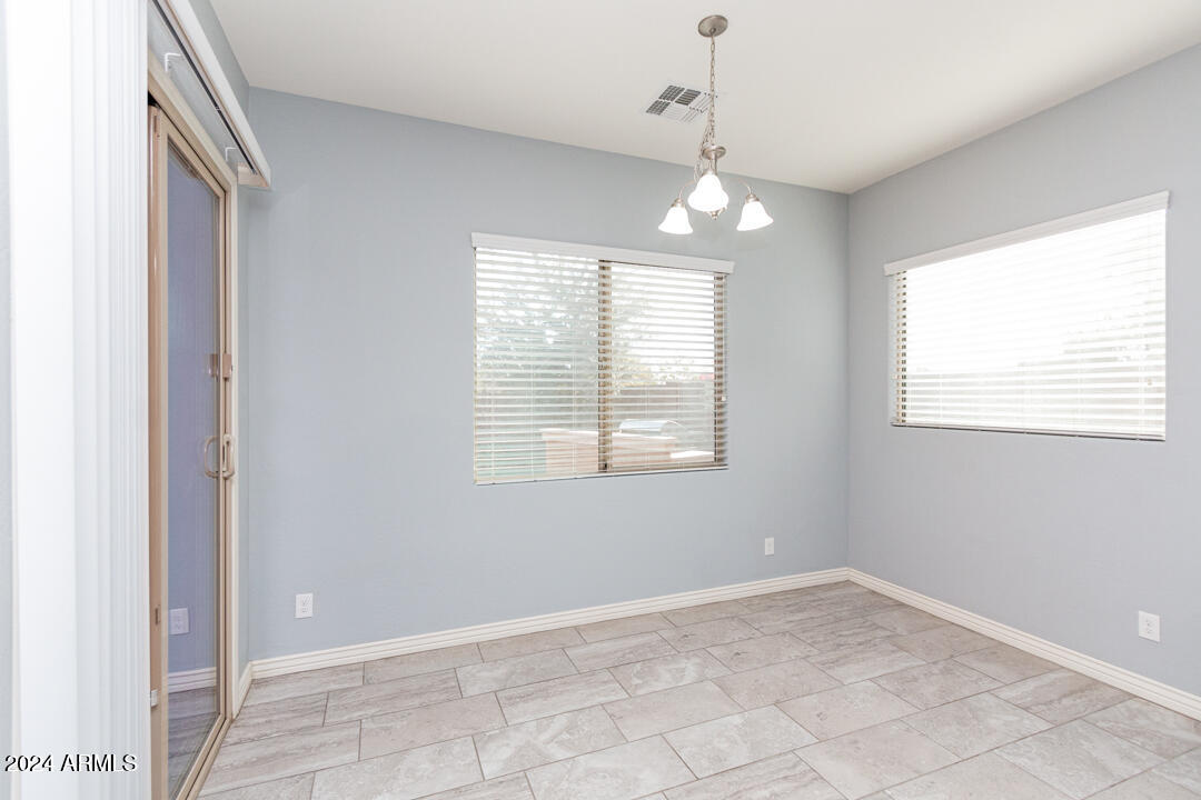 Undisclosed Address Gilbert, AZ 85298 - Photo 23 of 36 a view of an empty room with a window