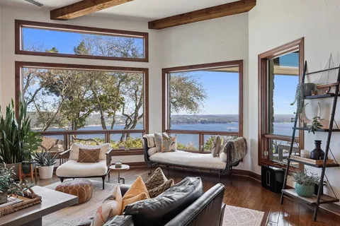 a living room with furniture and a large window