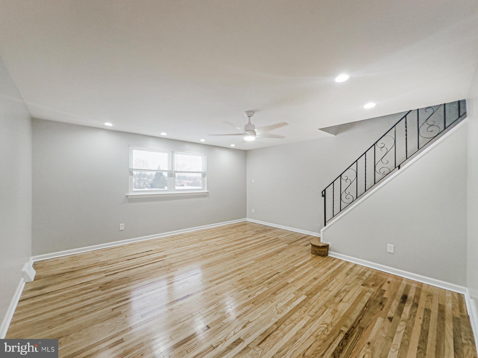 11118 Ridgeway Street Philadelphia, PA 19116 - Photo 12 of 38 a view of an empty room with wooden floor and a window