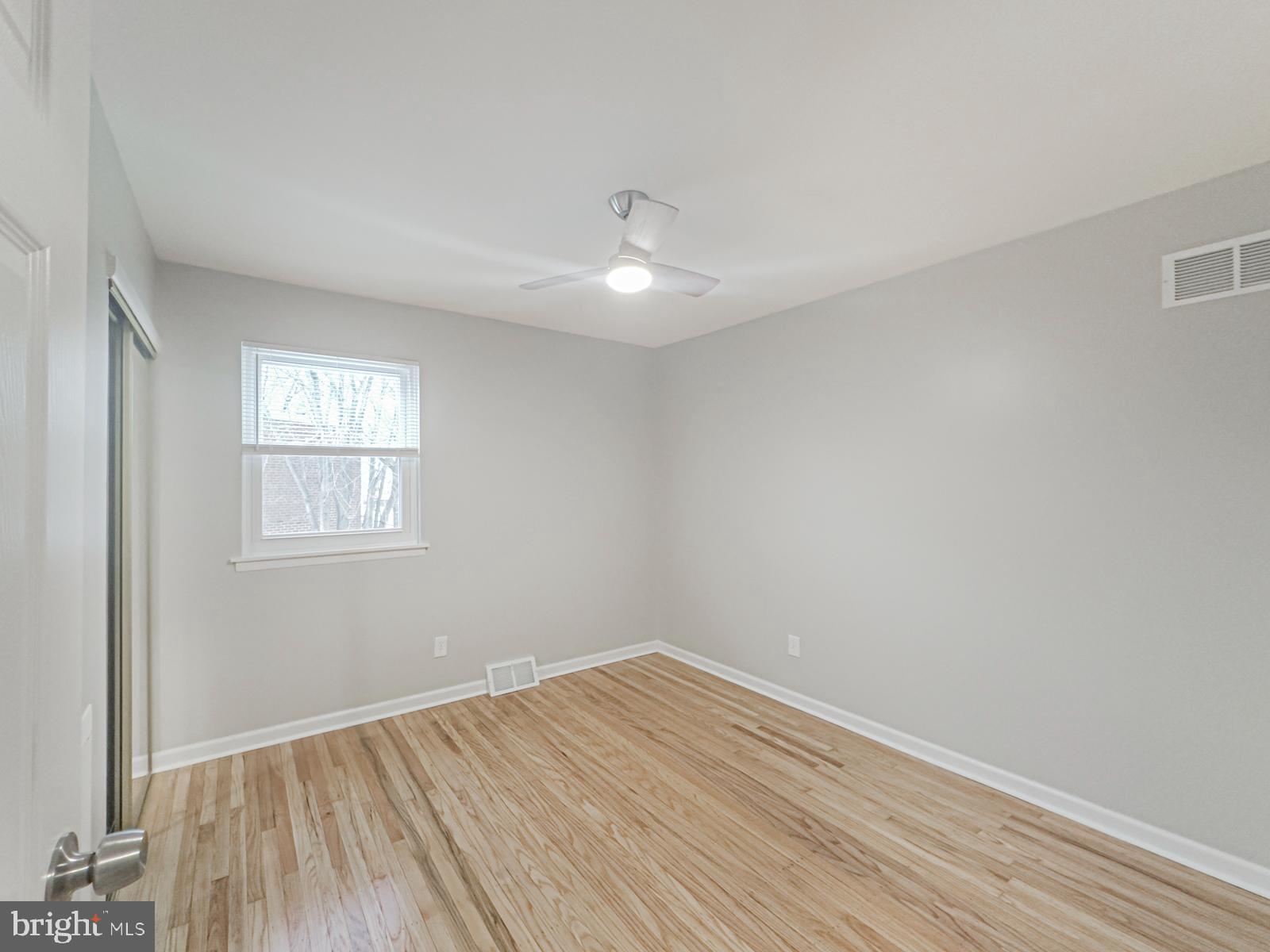11118 Ridgeway Street Philadelphia, PA 19116 - Photo 19 of 38 wooden floor in an empty room with a window