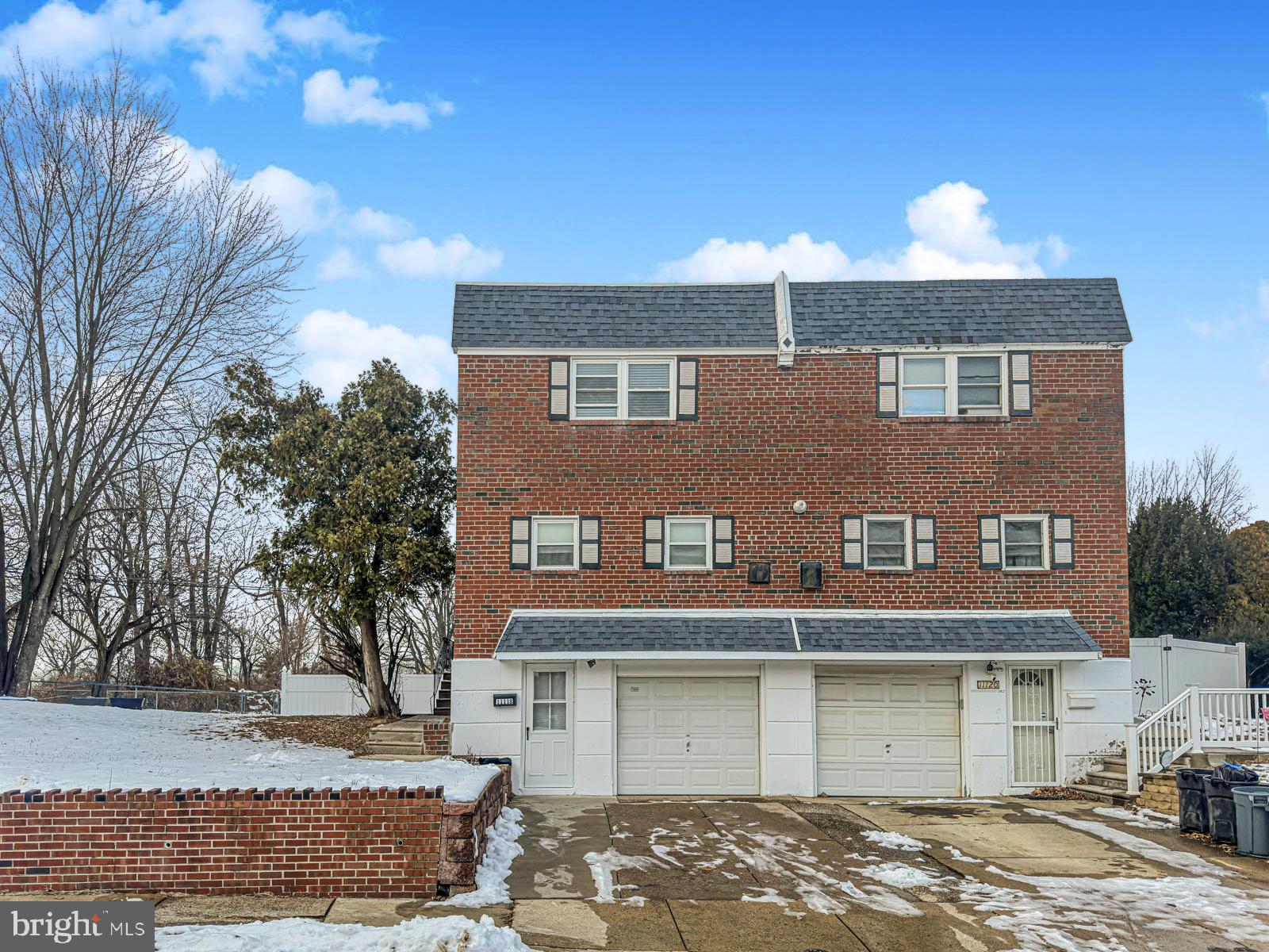11118 Ridgeway Street Philadelphia, PA 19116 - Photo 2 of 38 a front view of a house with a yard