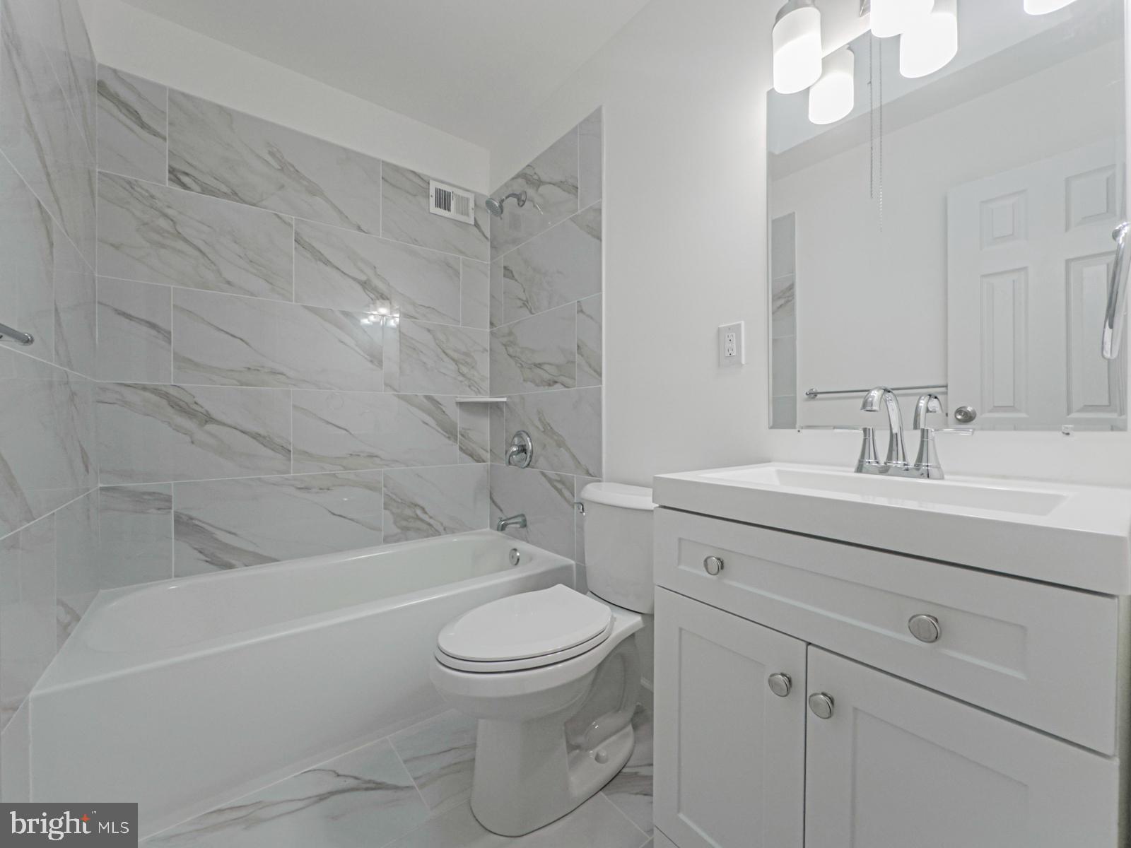 11118 Ridgeway Street Philadelphia, PA 19116 - Photo 22 of 38 a bathroom with a sink a toilet and shower