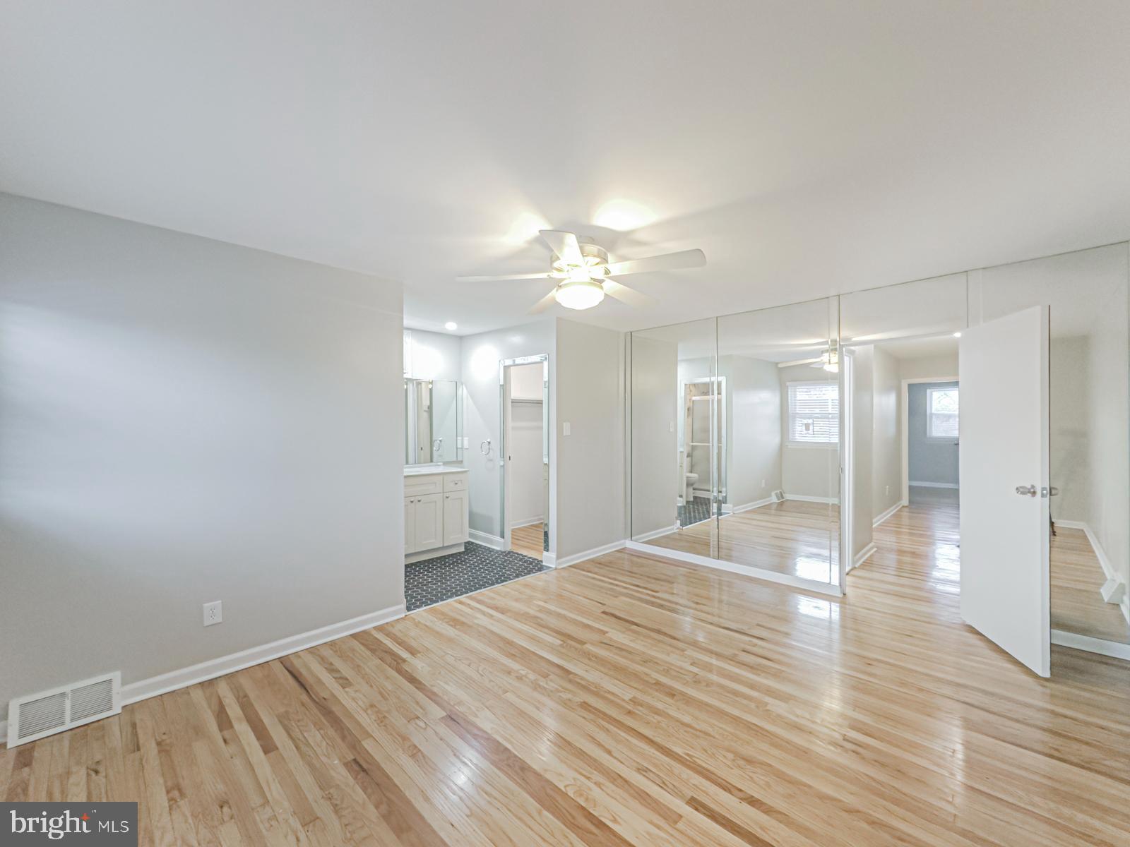 11118 Ridgeway Street Philadelphia, PA 19116 - Photo 25 of 38 a spacious bathroom with a granite countertop sink a mirror and shower
