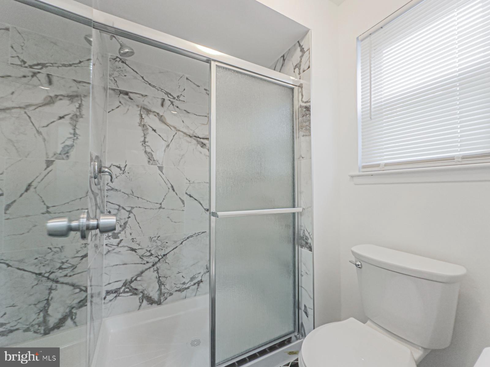 11118 Ridgeway Street Philadelphia, PA 19116 - Photo 27 of 38 a bathroom with a shower and toilet