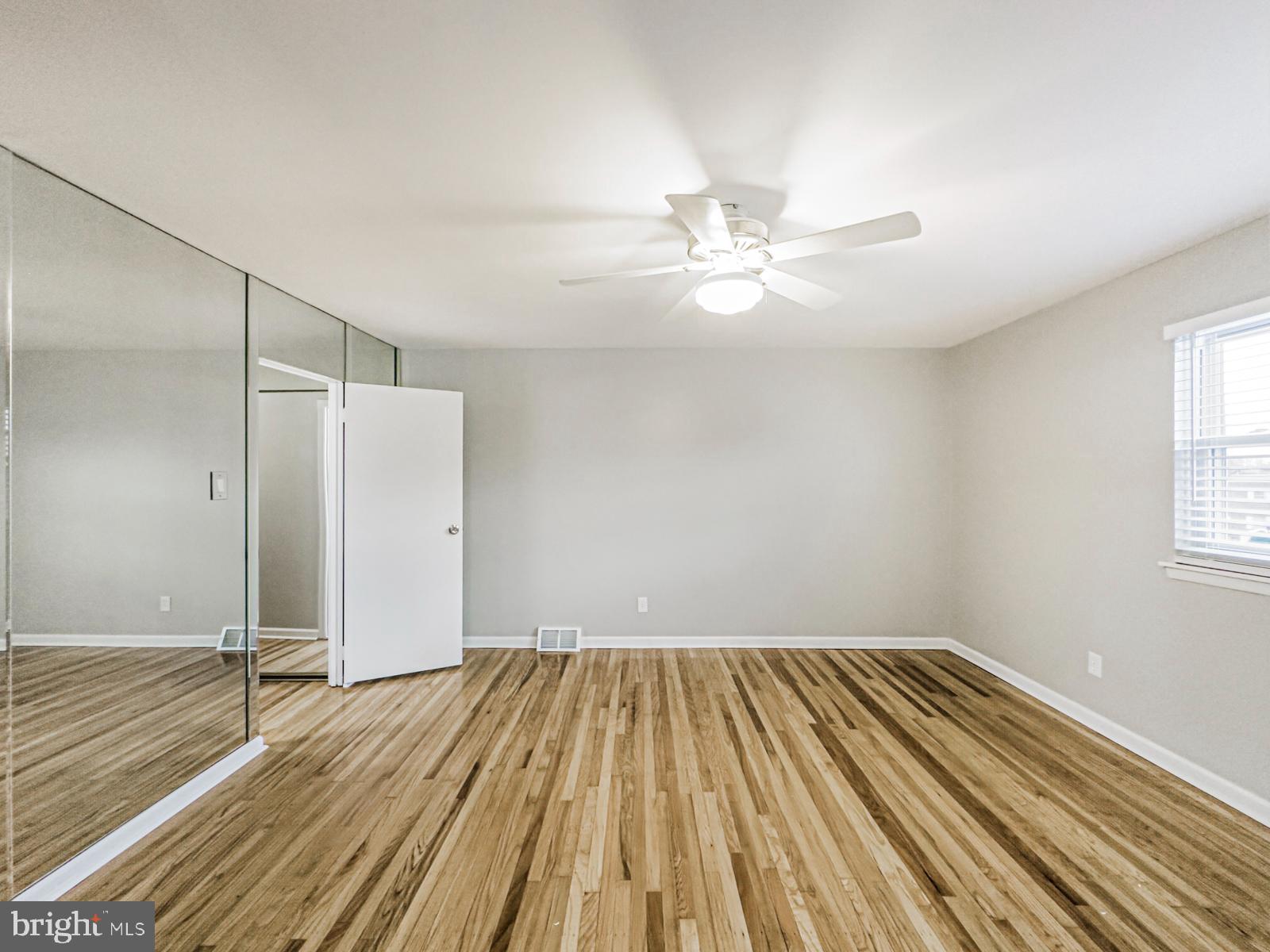 11118 Ridgeway Street Philadelphia, PA 19116 - Photo 29 of 38 wooden floor in an empty room with a window
