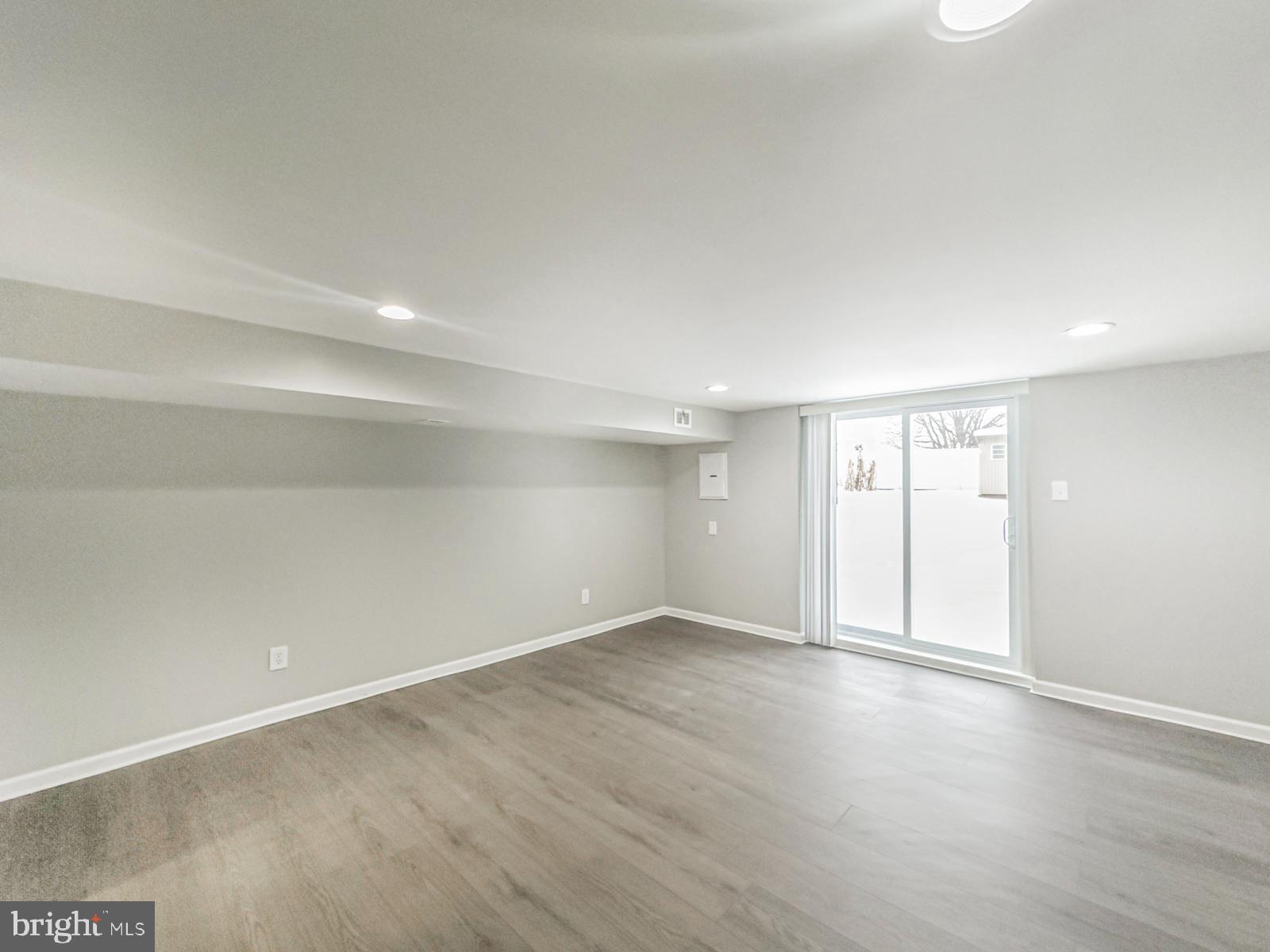 11118 Ridgeway Street Philadelphia, PA 19116 - Photo 33 of 38 an empty room with wooden floor and windows