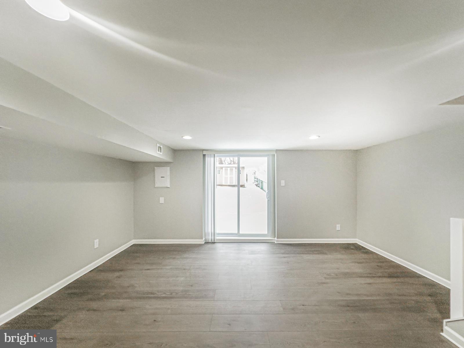 11118 Ridgeway Street Philadelphia, PA 19116 - Photo 34 of 38 wooden floor in an empty room with a window