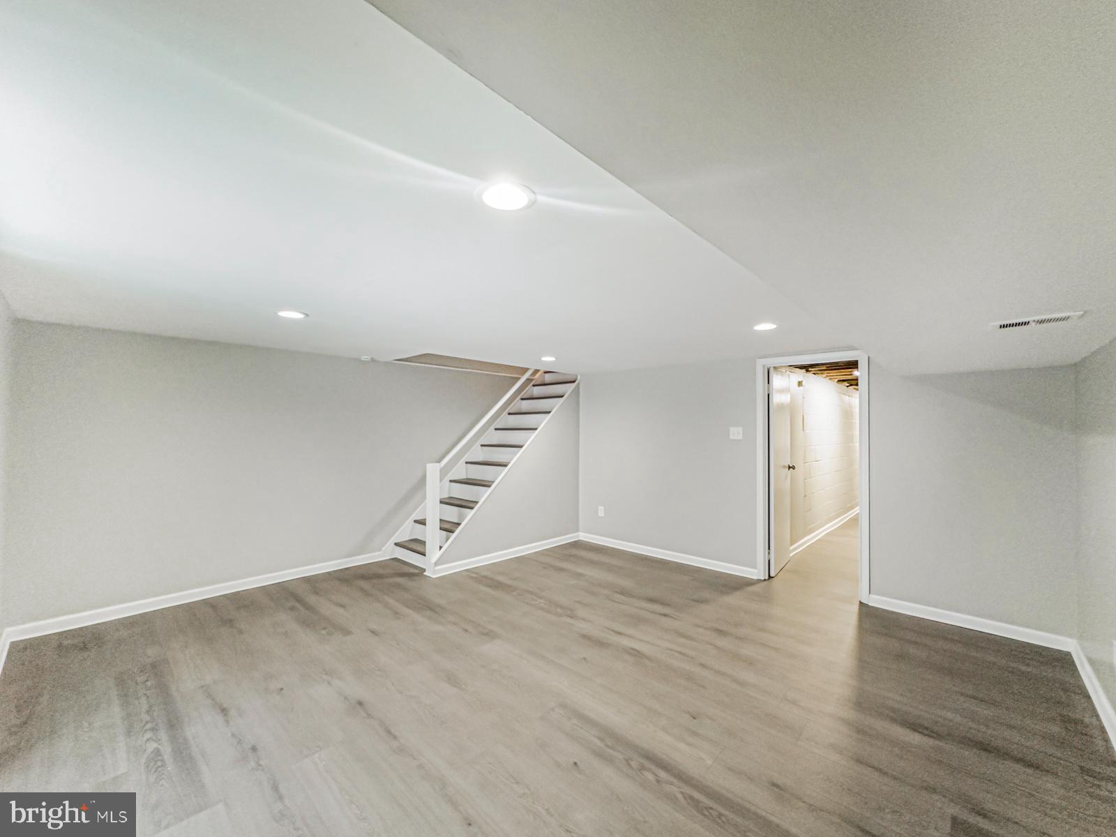 11118 Ridgeway Street Philadelphia, PA 19116 - Photo 35 of 38 an empty room with wooden floor and windows