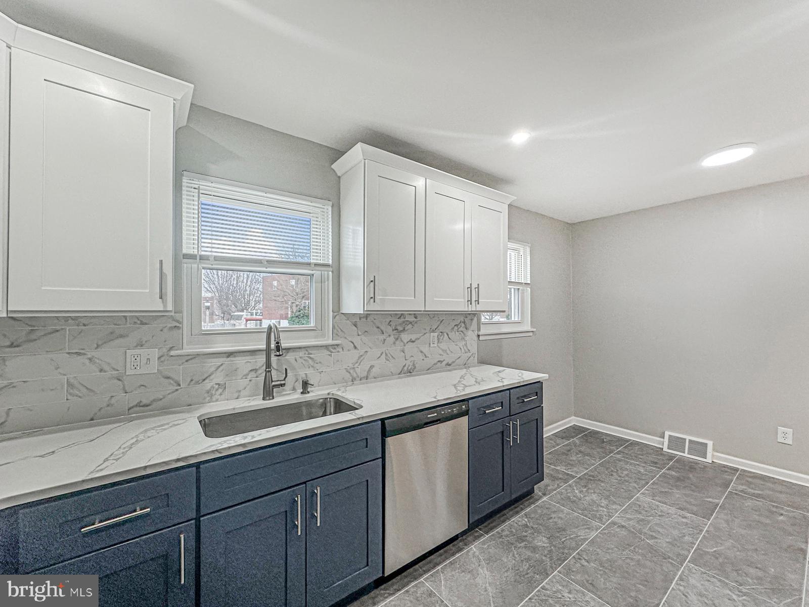 11118 Ridgeway Street Philadelphia, PA 19116 - Photo 10 of 38 a kitchen with a sink and cabinets