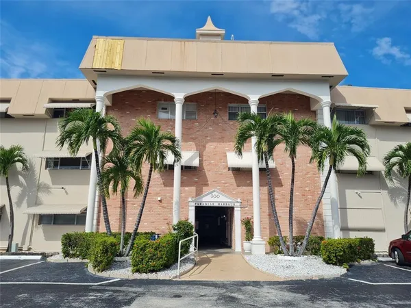 a front view of house with small garden