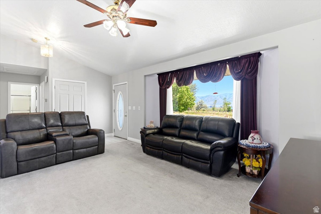 72 Canal Bank Road Garland, UT 84312 - Photo 5 of 40 Spacious living area featuring light gray carpet flooring and neutral wall tones