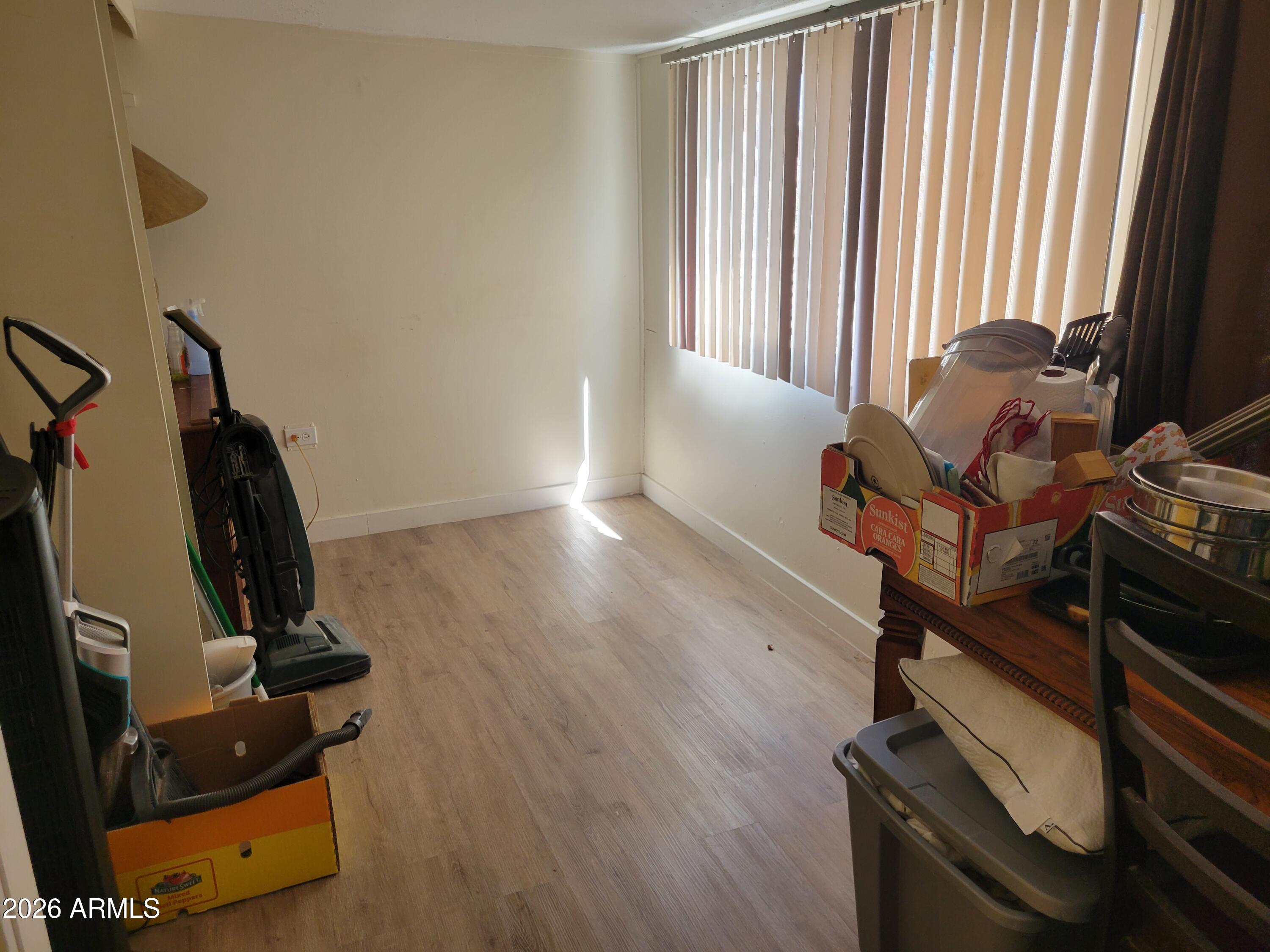 2460 East Main Street, Unit S03 Mesa, AZ 85213 - Photo 15 of 21 a room with gym equipment and windows