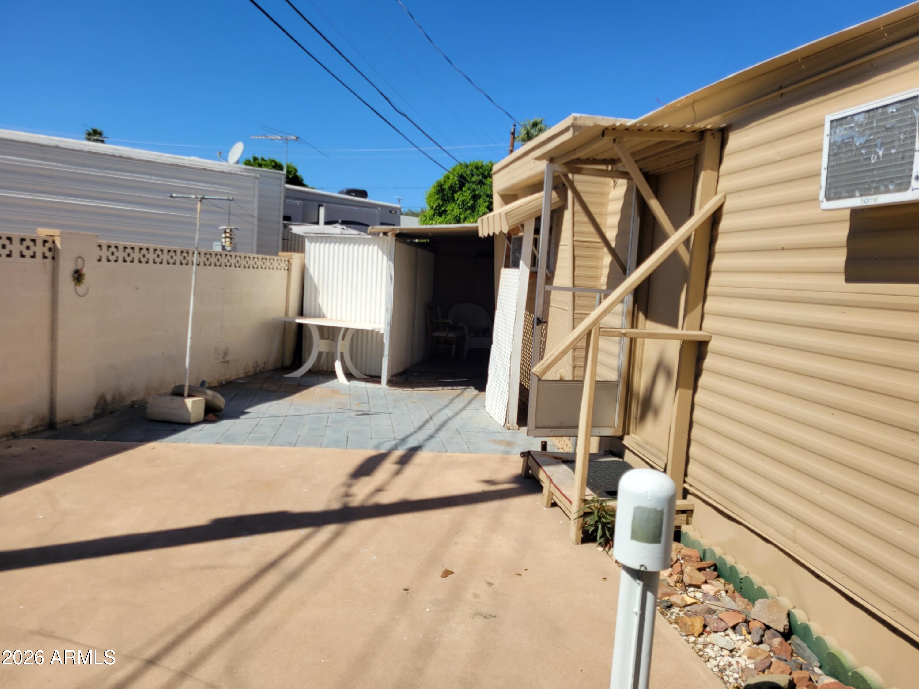 2460 East Main Street, Unit S03 Mesa, AZ 85213 - Photo 17 of 21 a house view with a backyard