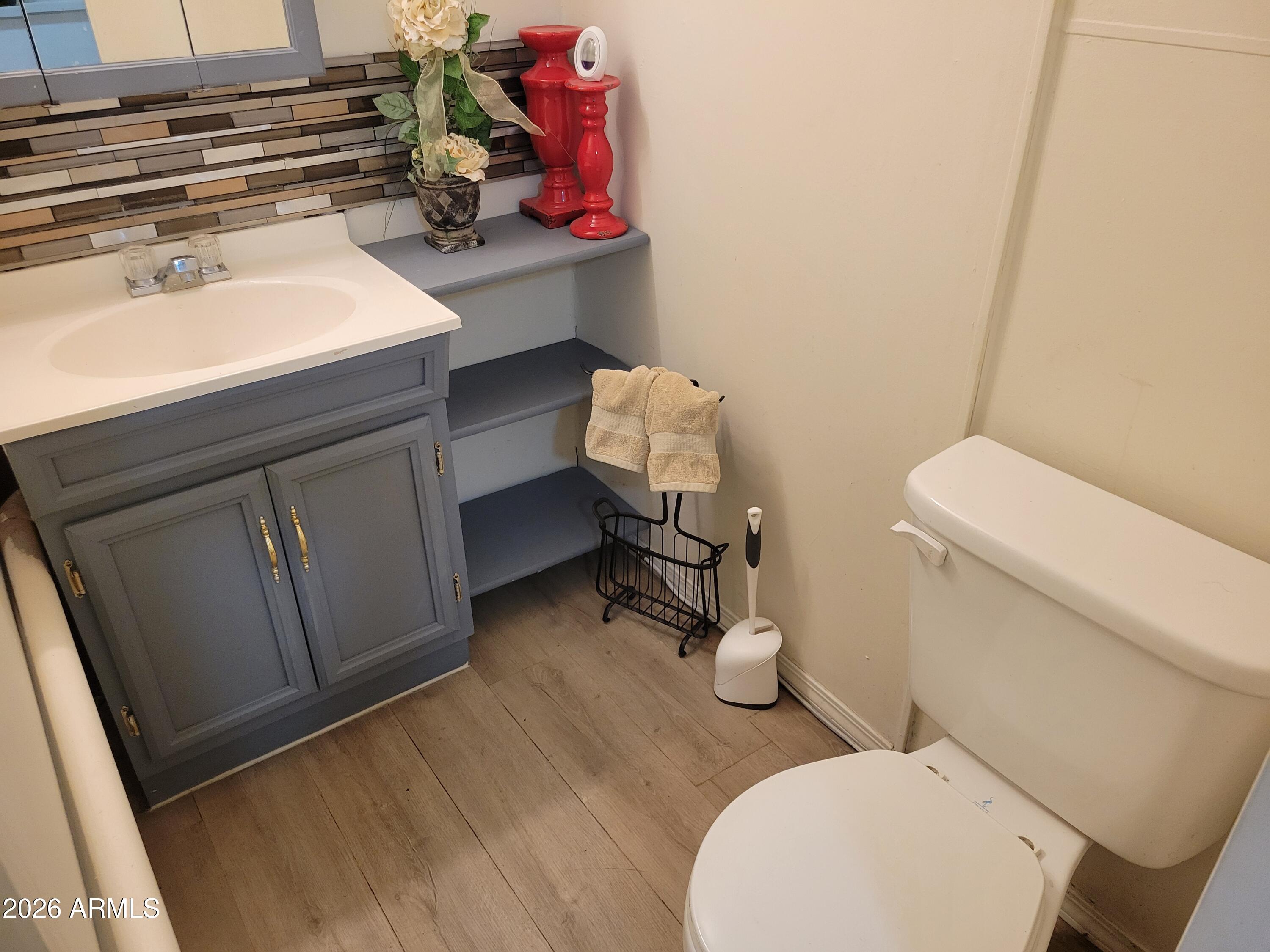 2460 East Main Street, Unit S03 Mesa, AZ 85213 - Photo 8 of 21 a bathroom with a sink and a toilet