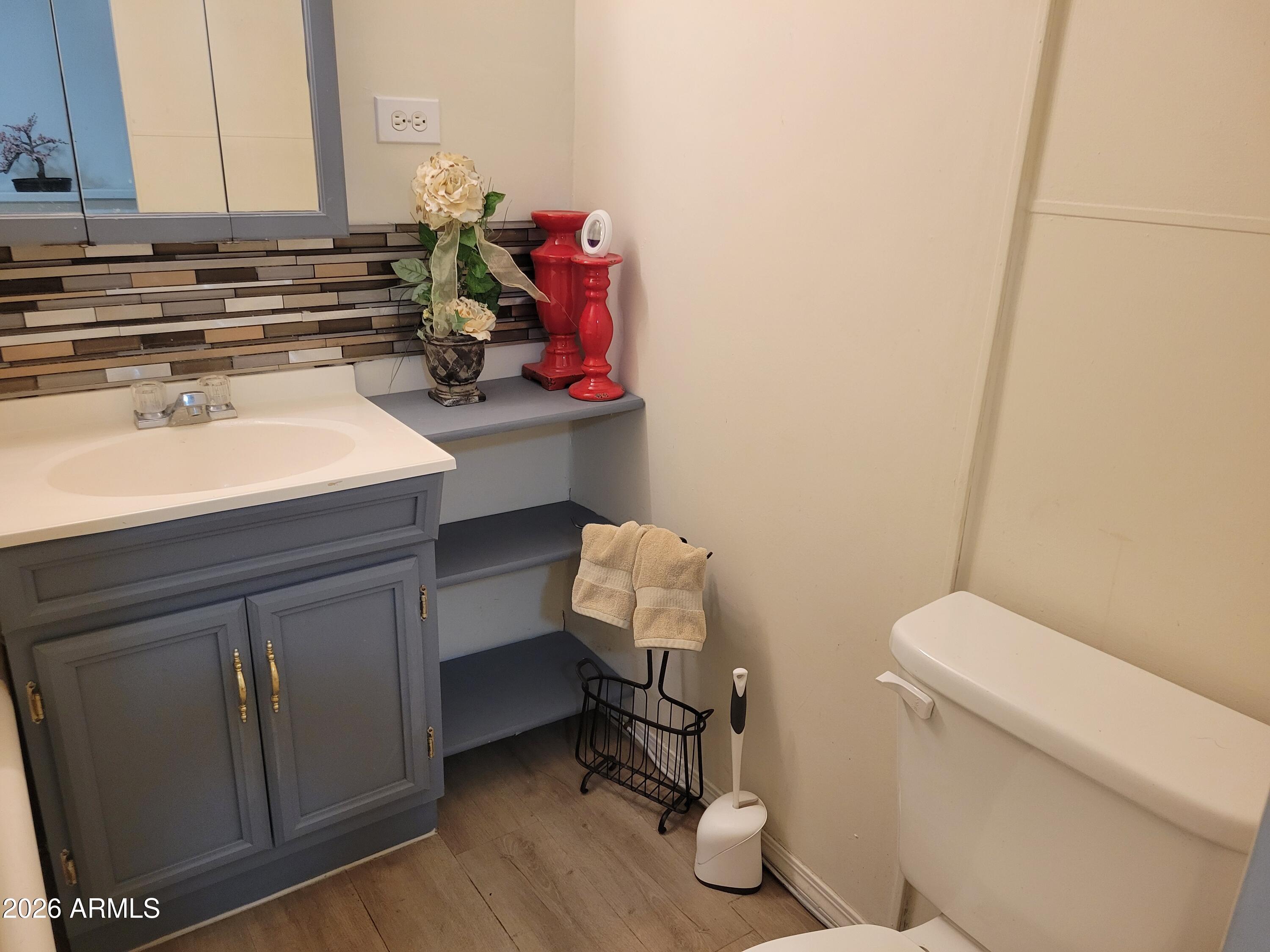 2460 East Main Street, Unit S03 Mesa, AZ 85213 - Photo 10 of 21 a bathroom with a sink toilet and vanity