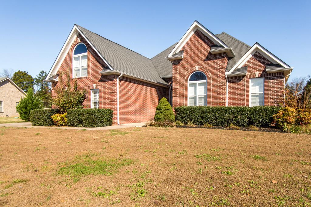 412 Reagan Road Mount Juliet, TN 37122 - Photo 3 of 28 a front view of a house with a yard and garage