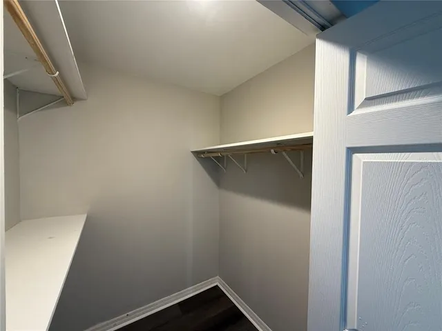 a view of an entryway with wooden floor