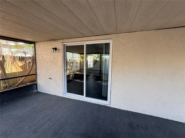 a view of a pathway of a house with wooden stairs