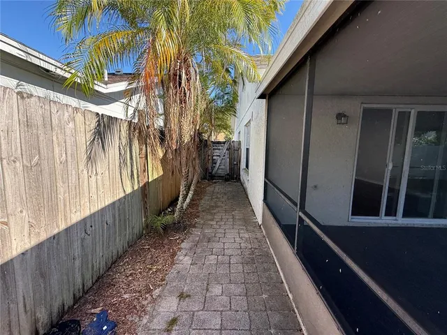 a view of a backyard with a tree