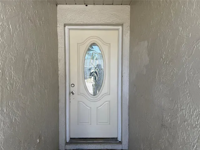 a view of a living room with a wooden floor