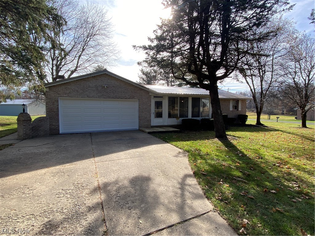 23551 Sandy Creek Road Minerva, OH 44657 - Photo 2 of 35 Single story home with a front lawn and a garage
