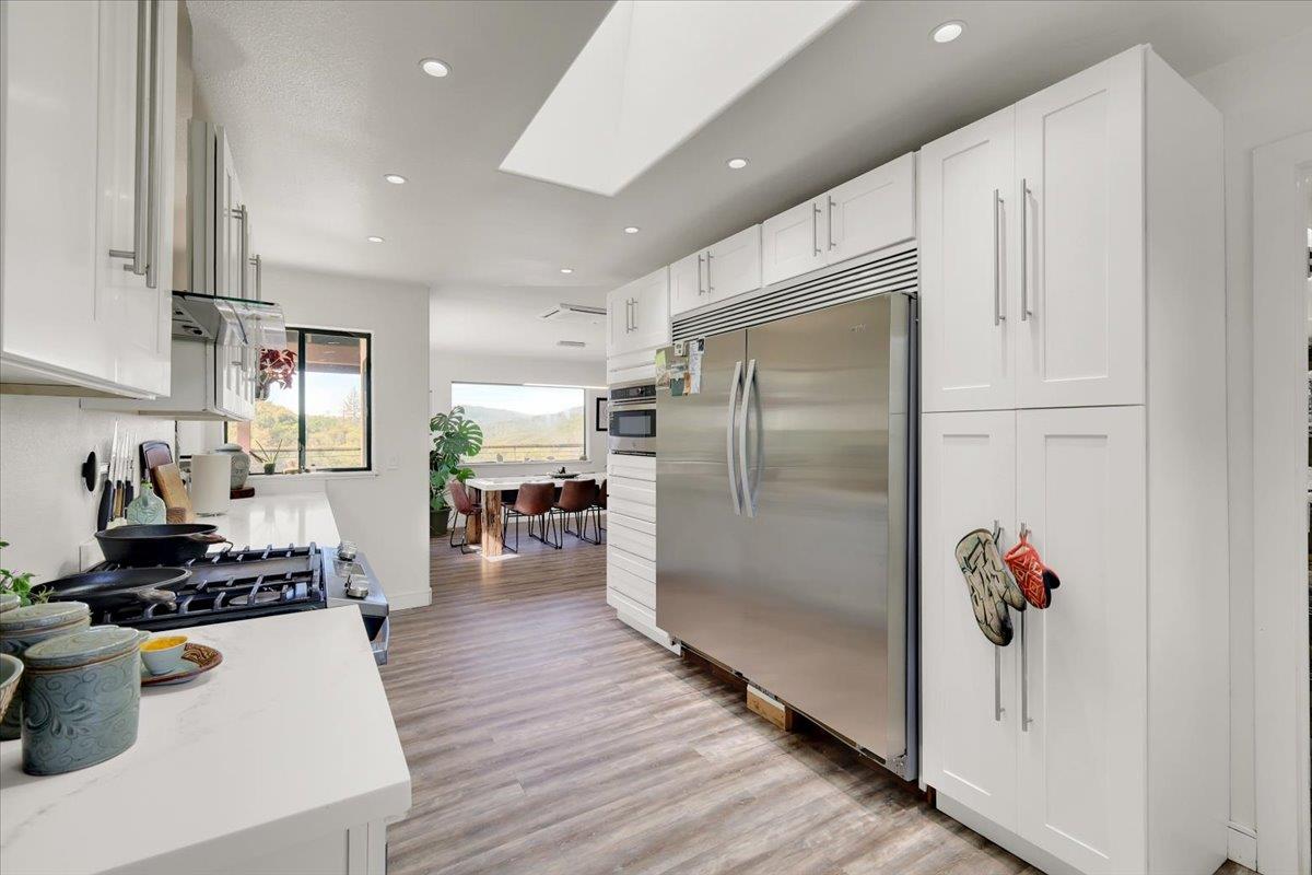 17513 Derby Way Penn Valley, CA 95946 - Photo 16 of 78 a kitchen with stainless steel appliances a refrigerator and a stove top oven