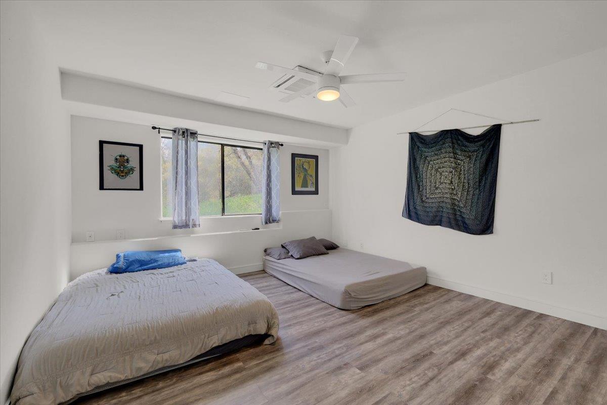 17513 Derby Way Penn Valley, CA 95946 - Photo 36 of 78 a bedroom with two beds and a large mirror