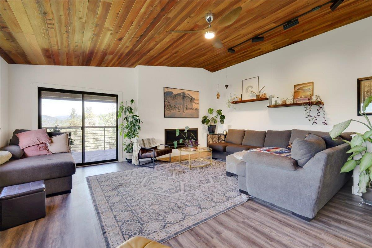 17513 Derby Way Penn Valley, CA 95946 - Photo 4 of 78 a living room with furniture and a fireplace