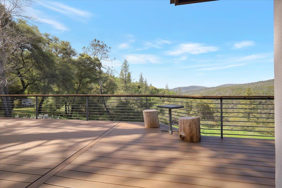 17513 Derby Way Penn Valley, CA 95946 - Photo 46 of 78 a view of a terrace with wooden floor and fence