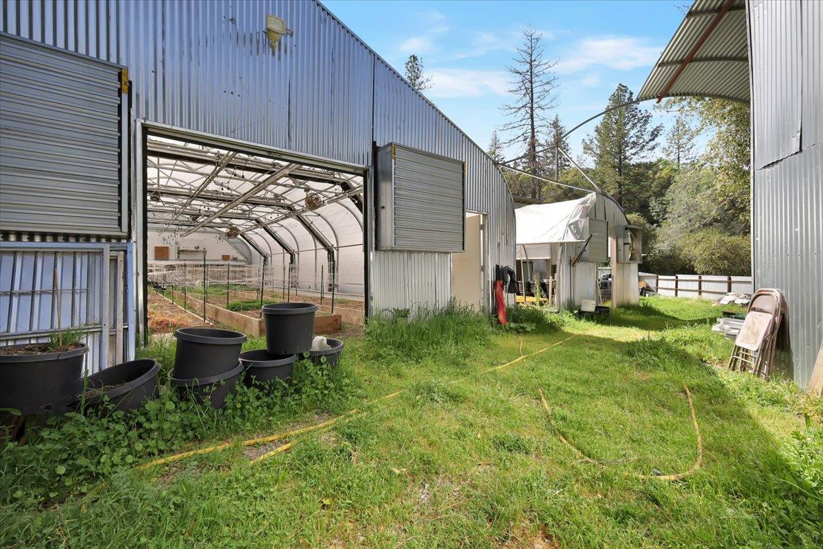17513 Derby Way Penn Valley, CA 95946 - Photo 56 of 78 a view of a chair and table in backyard of the house