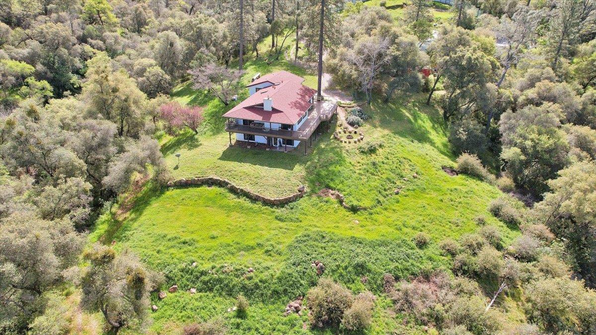 17513 Derby Way Penn Valley, CA 95946 - Photo 65 of 78 a backyard of a house with a yard and outdoor seating
