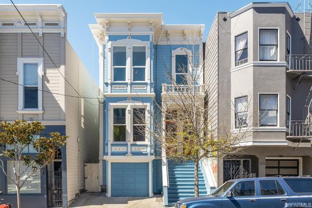 a front view of a multi story residential apartment building