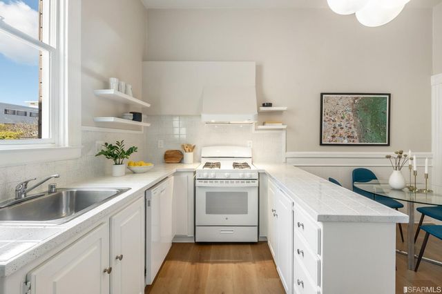 a bedroom with bed and a couch