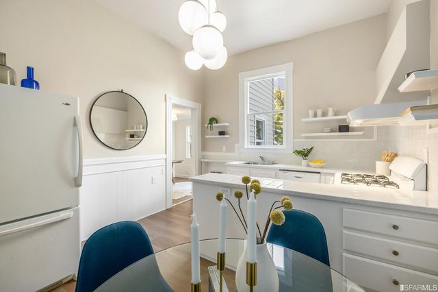 a bedroom with a bed and a lamp