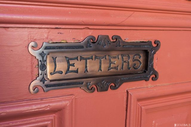 a view of a livingroom with furniture and a potted plant