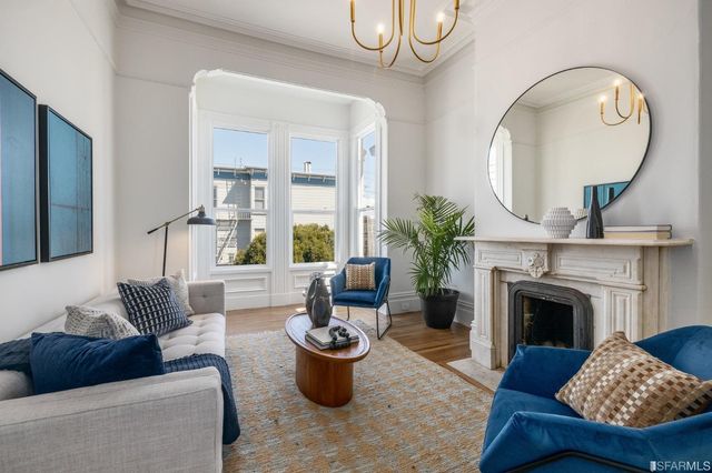 a kitchen with stainless steel appliances granite countertop a stove sink and cabinets