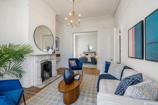 a kitchen with stainless steel appliances a stove a sink a refrigerator and cabinets