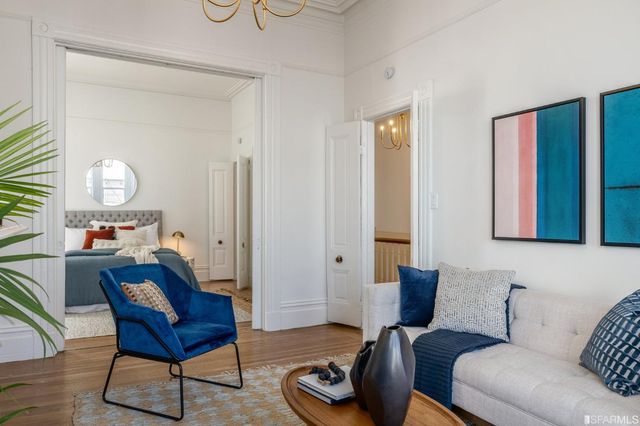 a view of a patio with table and chairs and potted plants