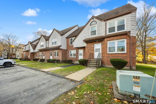 a view of a house with a yard