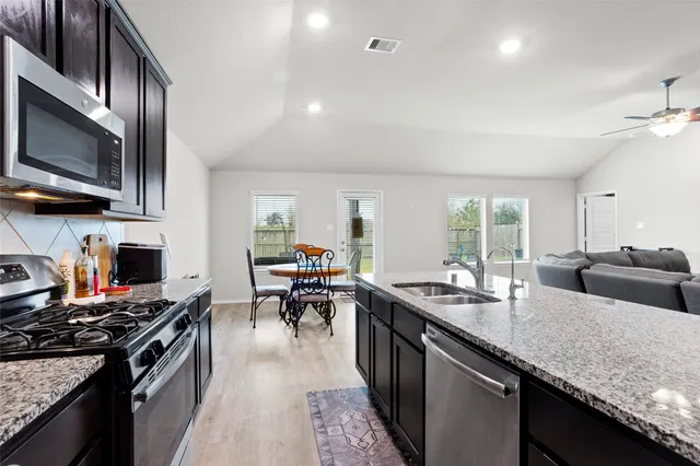 a dining room with furniture and window