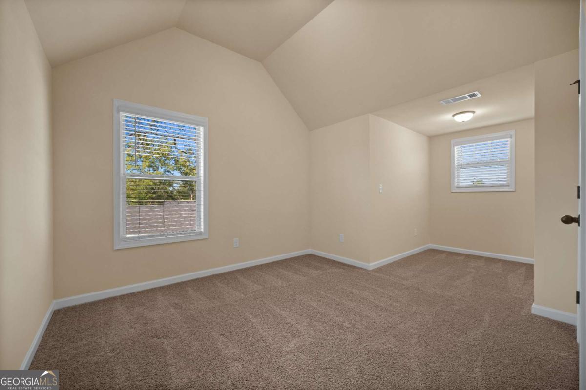 2330 Walker Drive, Unit 11 Hampton, GA 30228 - Photo 12 of 18 an empty room with a window
