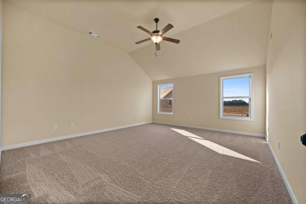 2330 Walker Drive, Unit 11 Hampton, GA 30228 - Photo 14 of 18 a view of an empty room with a window