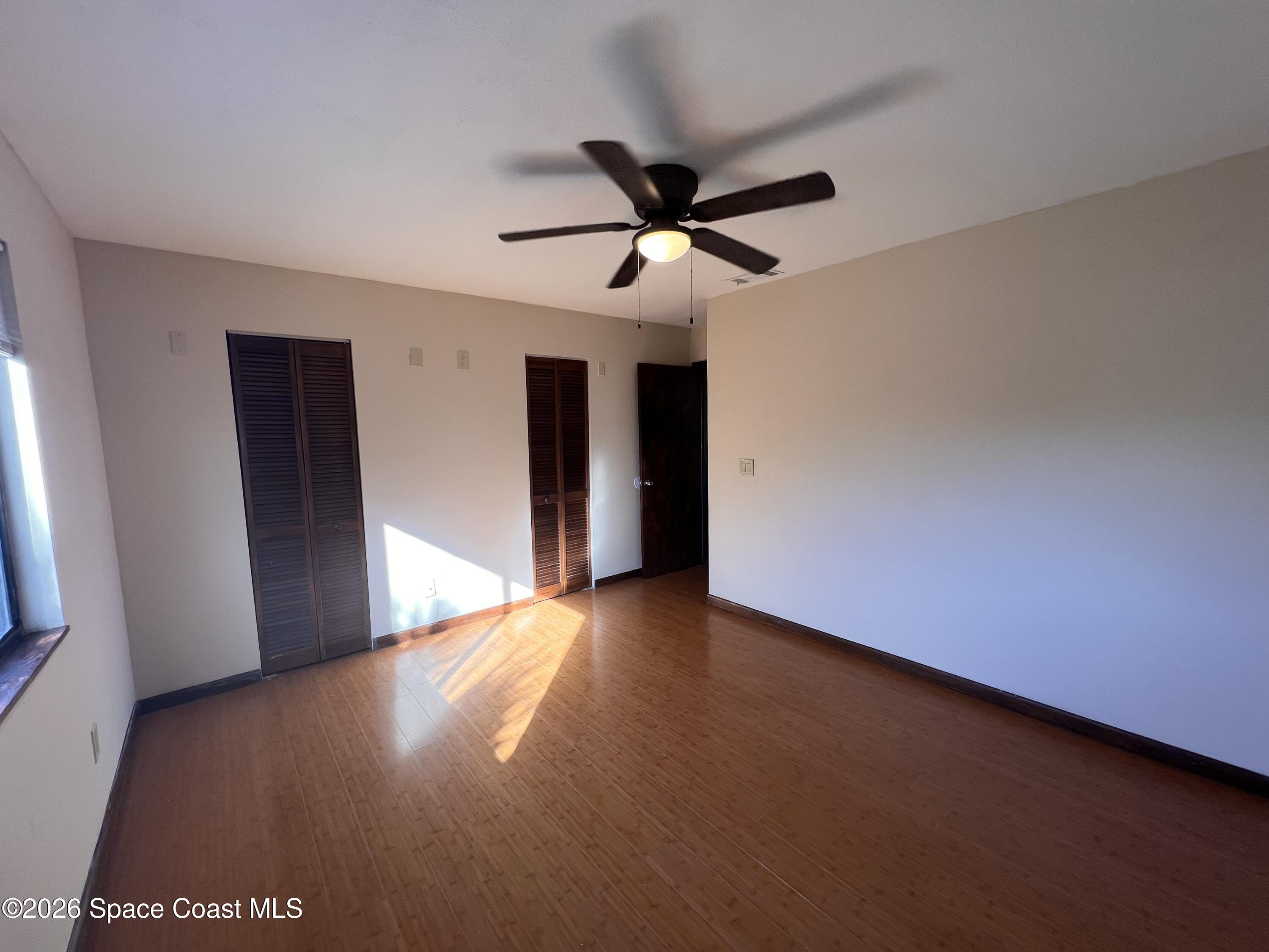 4611 Tree Ridge Lane Northeast Palm Bay, FL 32905 - Photo 11 of 19 a view of an empty room with a window
