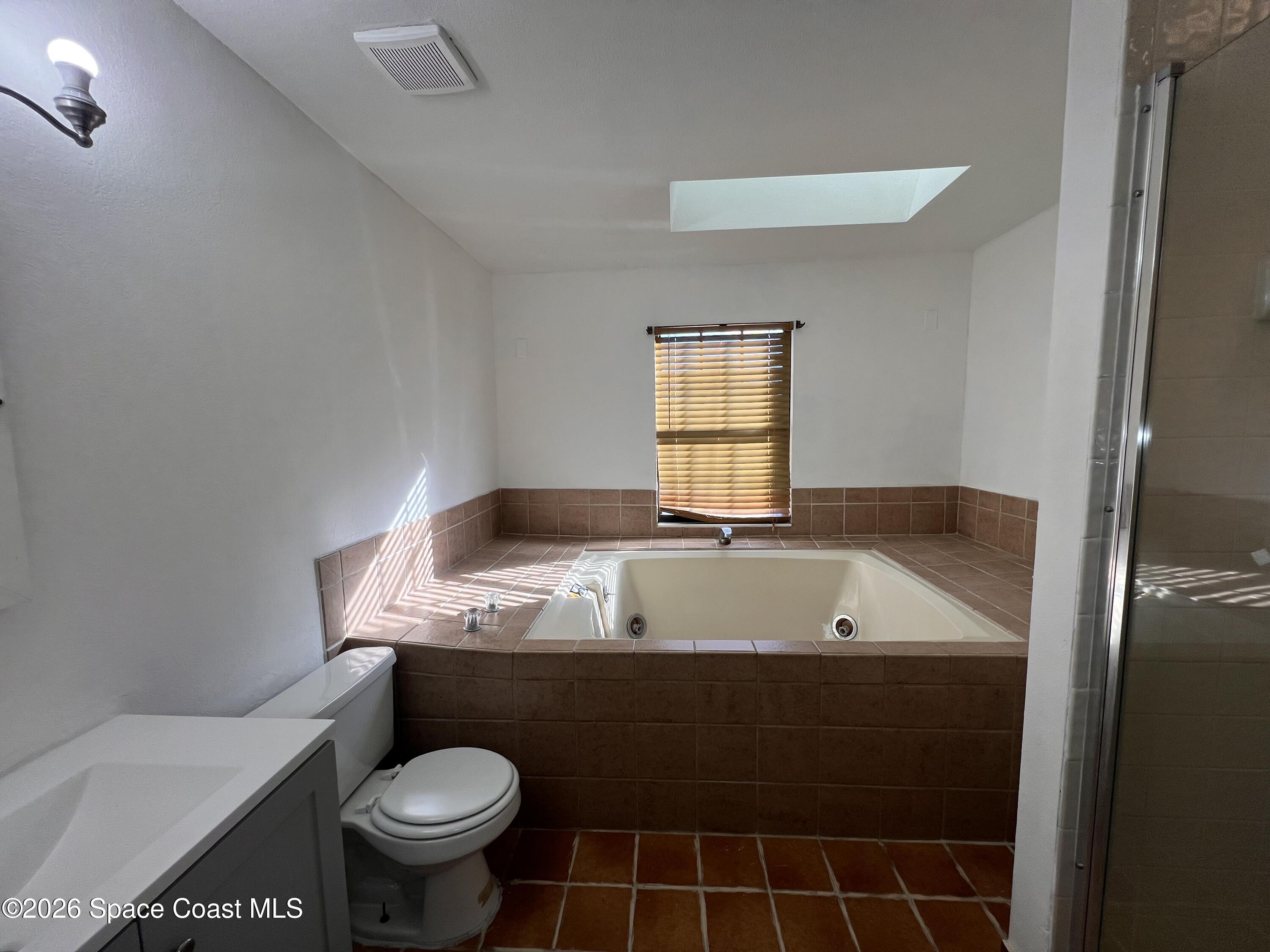 4611 Tree Ridge Lane Northeast Palm Bay, FL 32905 - Photo 14 of 19 a bathroom with a granite countertop sink and a mirror
