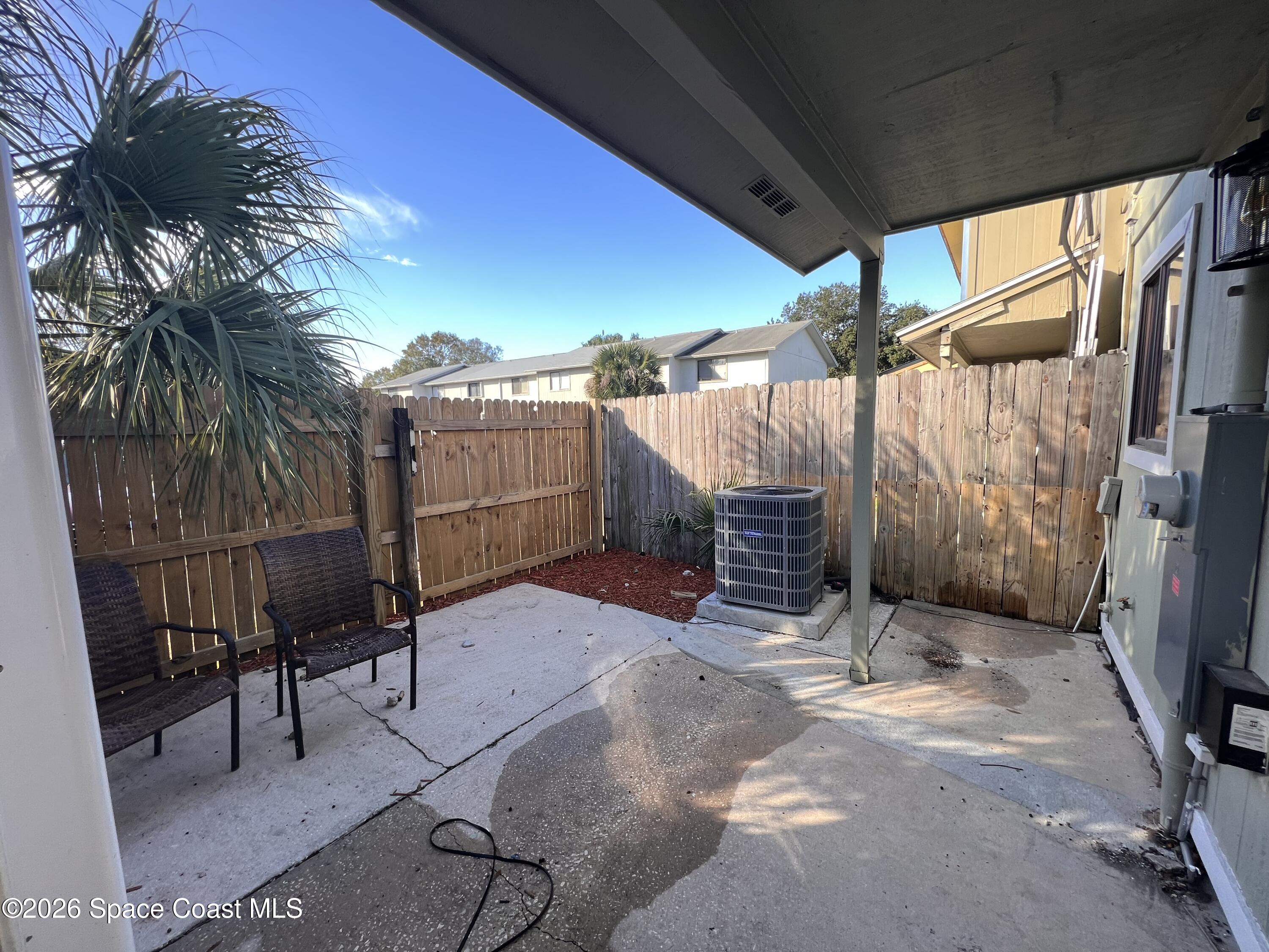4611 Tree Ridge Lane Northeast Palm Bay, FL 32905 - Photo 17 of 19 a view of a backyard