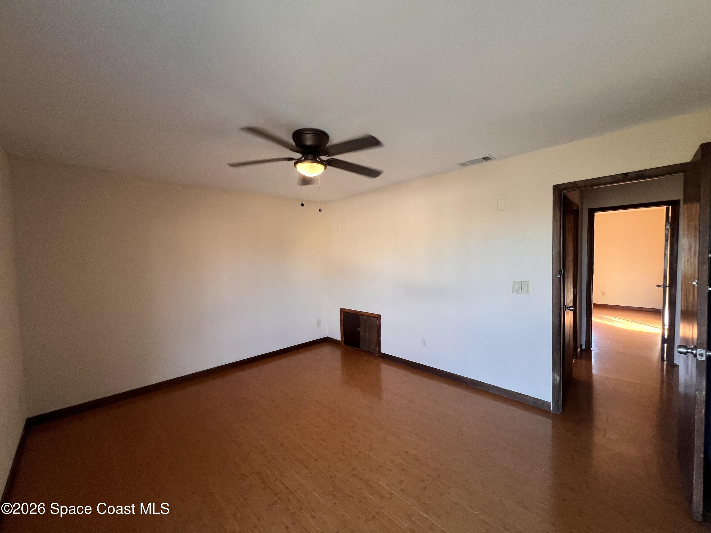 4611 Tree Ridge Lane Northeast Palm Bay, FL 32905 - Photo 18 of 19 a view of an empty room with window