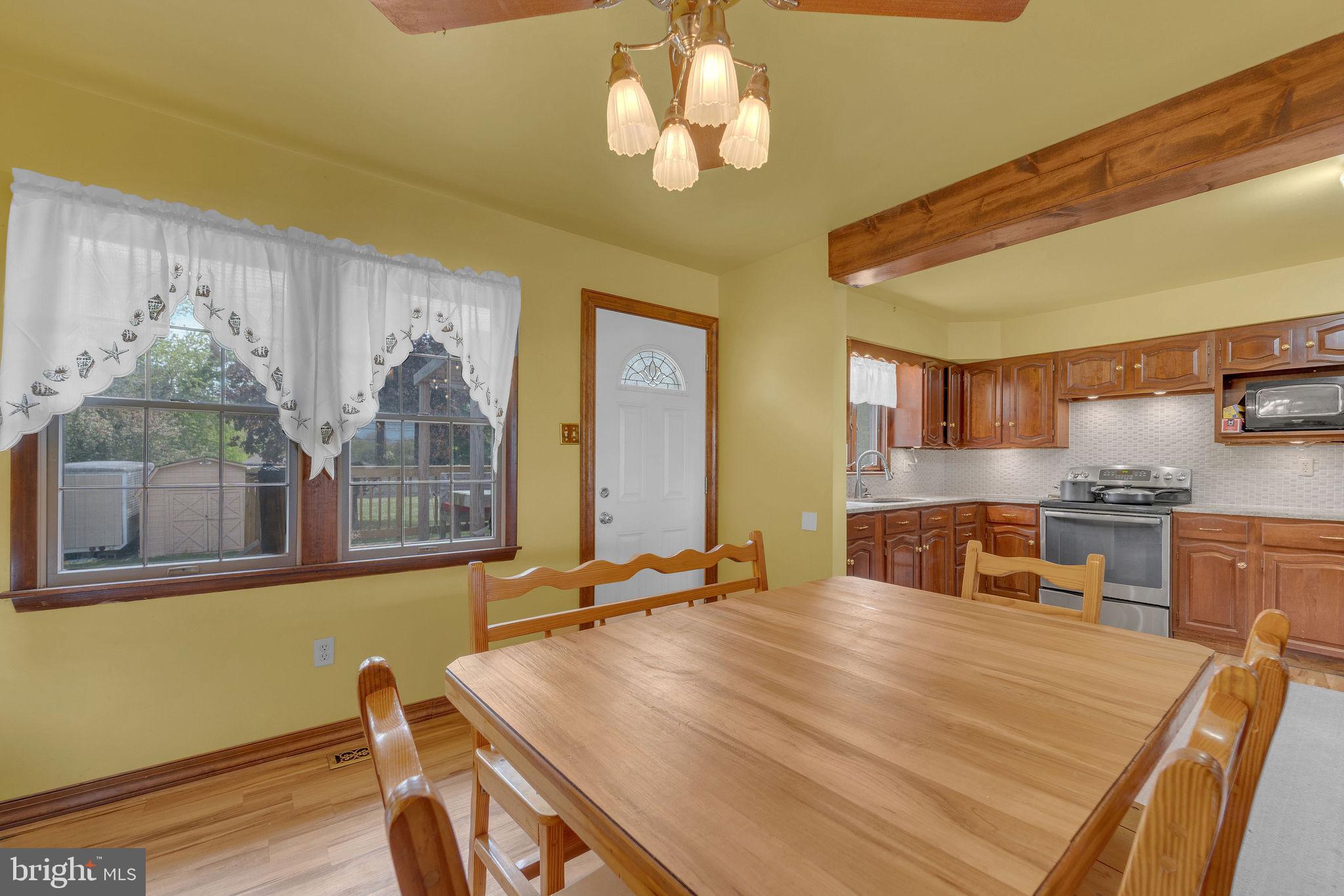 60 Waterford-Blue Anchor Road Hammonton, NJ 08037 - Photo 11 of 30 a room with stainless steel appliances kitchen island granite countertop a table chairs in it and wooden floors