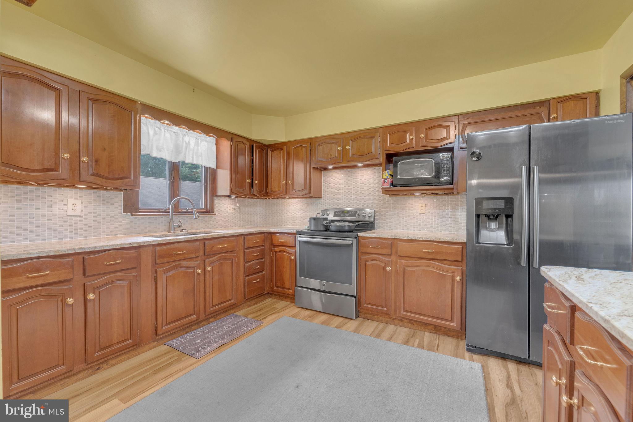 60 Waterford-Blue Anchor Road Hammonton, NJ 08037 - Photo 12 of 30 a kitchen with stainless steel appliances granite countertop a refrigerator sink and cabinets